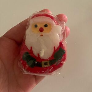 Santa candle. New, unopened but slightly damaged through plastic. Might float?